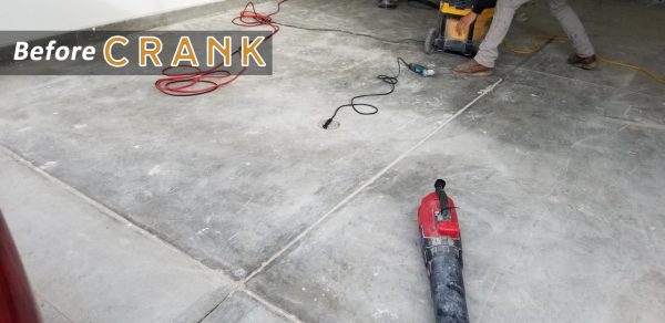 Garage floor before coating, cracked and stained