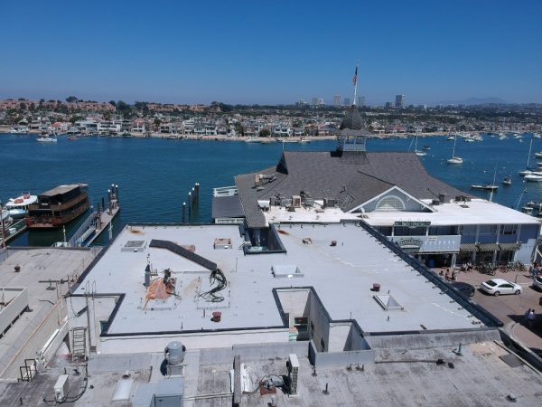 Flat roof on a waterfront building after a new roof coating
